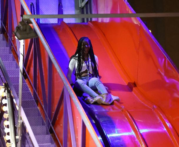 Girl goes down slide at Thunder Over Louisville