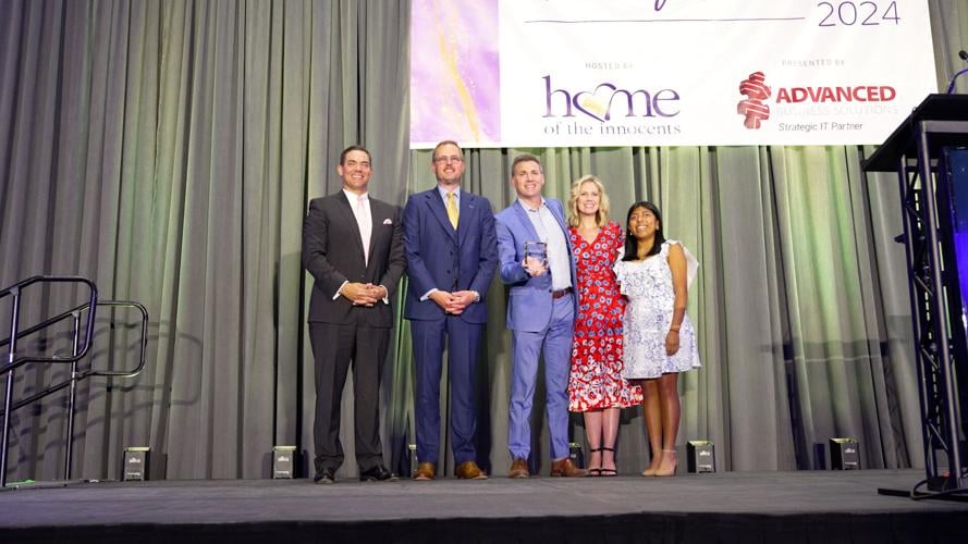 Jude Redfield accepts Home of the Innocents award