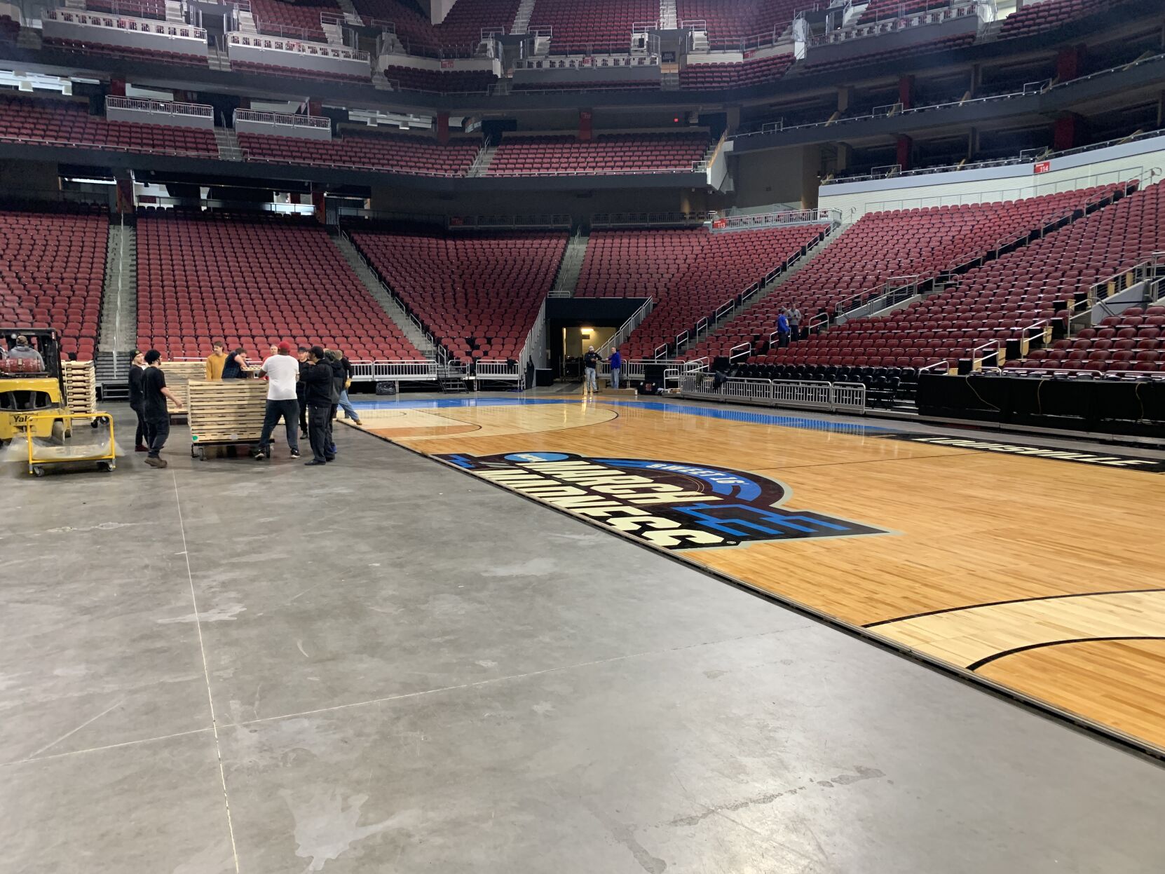 NCAA FLOOR  BEING INSTALLED AT YUM CENTER 3-21-2023 (18).JPG