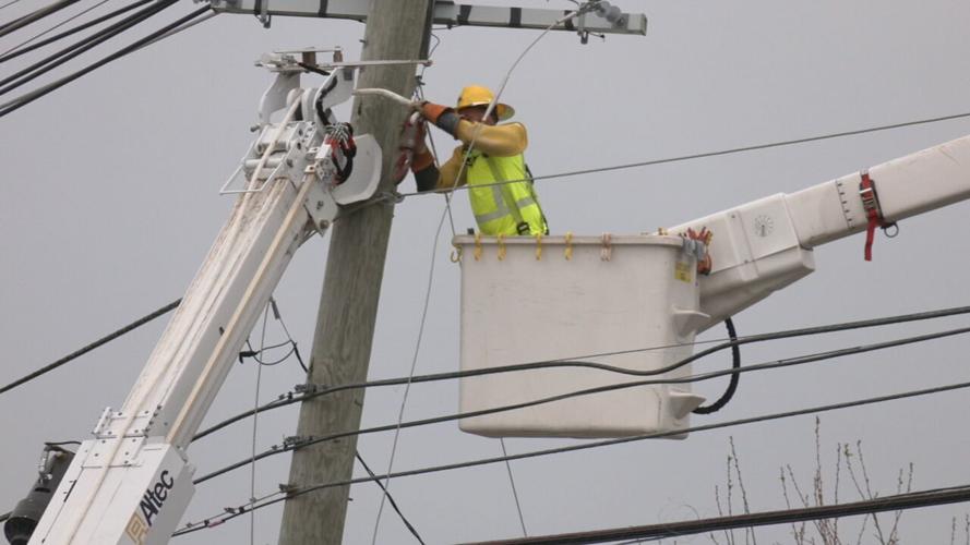 LG&E_KU lineman in bucket truck working on power line.jpeg