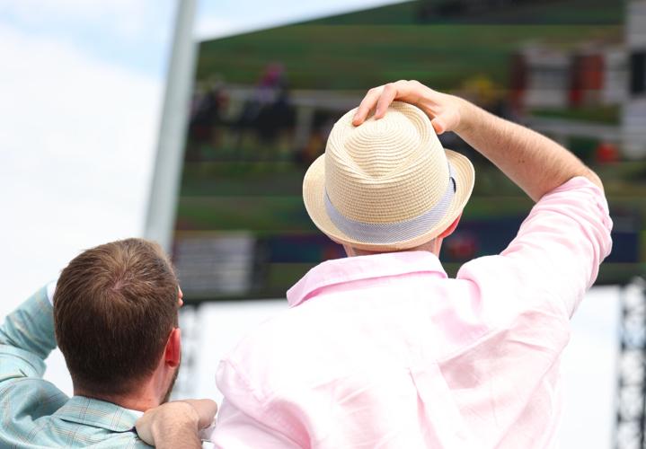 Two people look at video board.JPG