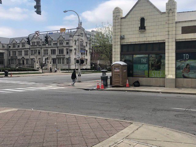 Hand-washing station and portable toilet at 2nd Street and Broadway