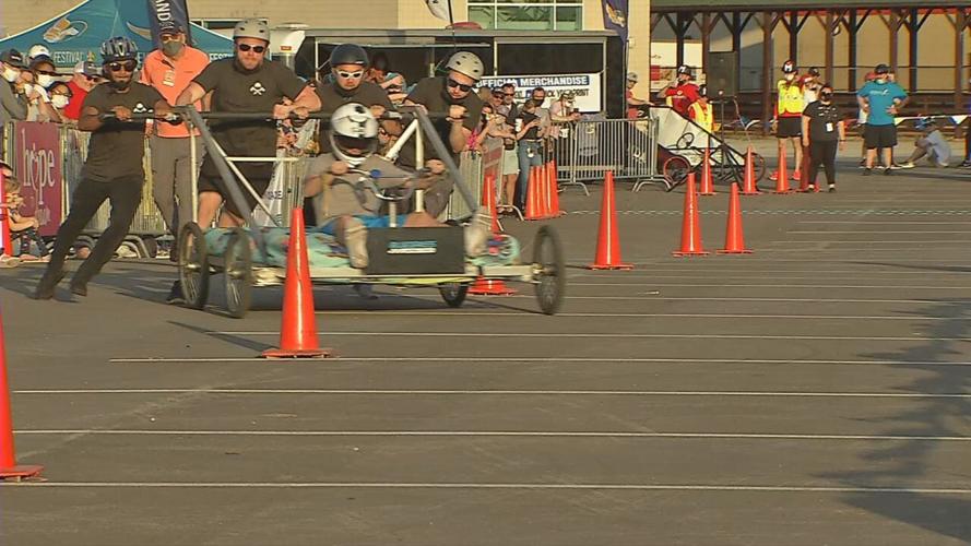 A team participates in the Kentucky Derby Festival's Great Bed Races o