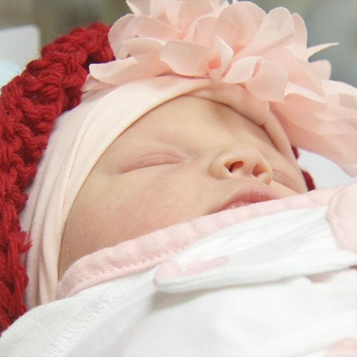 Newborns at Baptist Health Louisville receive red hats in honor of