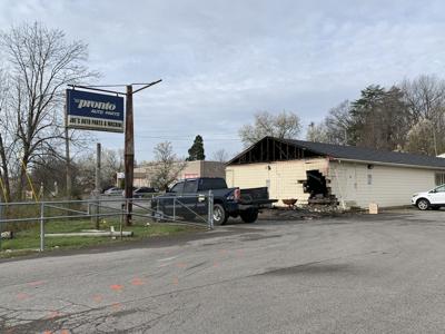 Burning car toasts building after crash.jpg