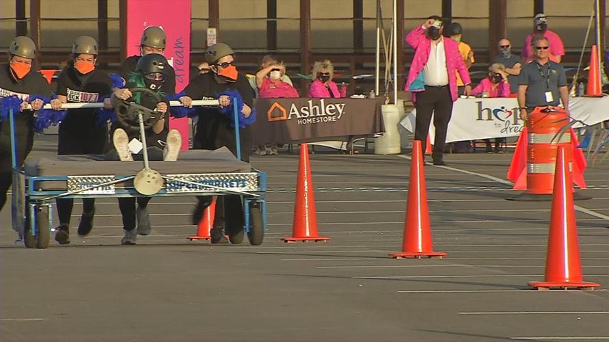 A team participates in the Kentucky Derby Festival's Great Bed Races o
