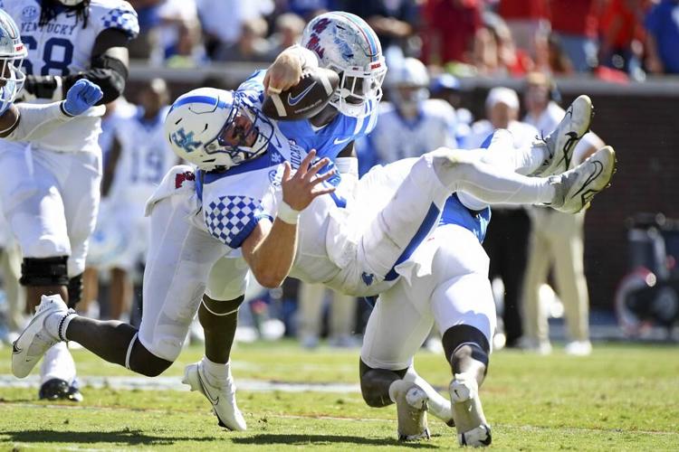 Mississippi safety AJ Finley forces a fumble from Kentucky quarterback Will Levis.jpeg