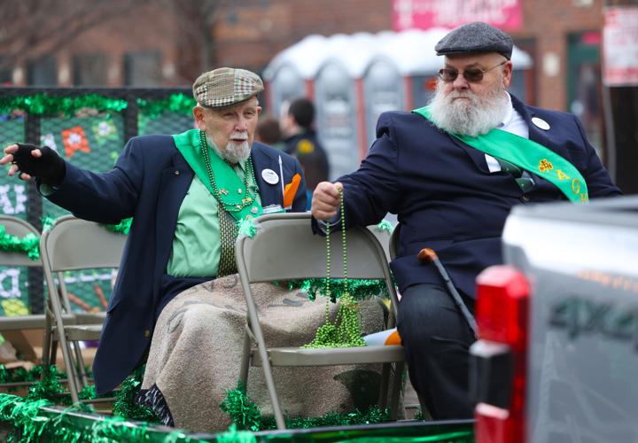 Two men ride on float at St. Patrick's Day Parade.JPG