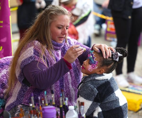 Child gets face painted at Harvest Homecoming.JPG