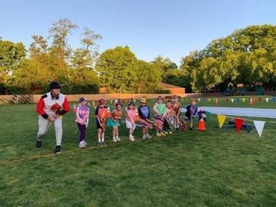 Keith Kaiser racing with kids at Kindergarten Derby at Collegiate