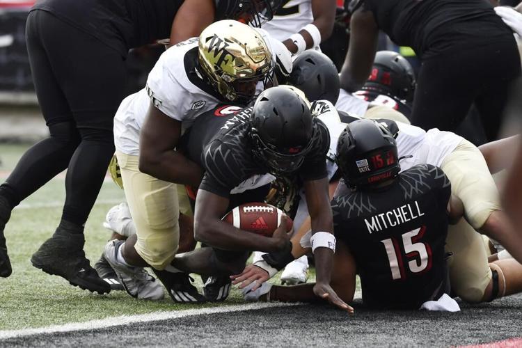 Louisville quarterback Malik Cunningham crosses the goal line.jpeg