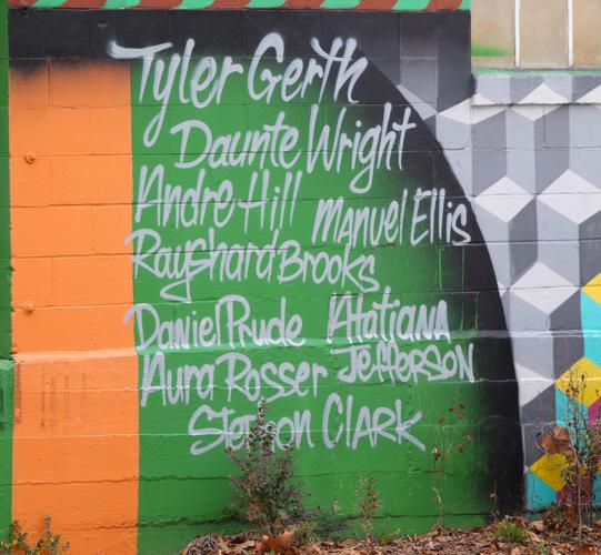 Names of those killed in Louisville mural.JPG