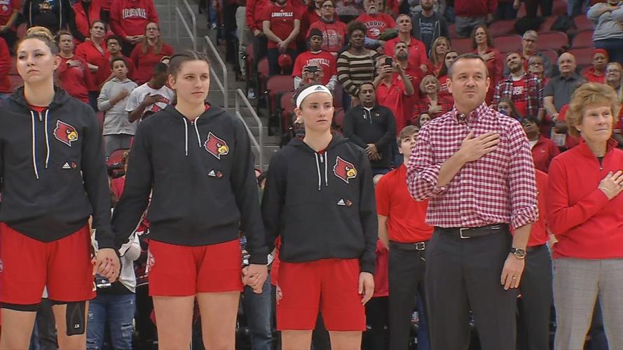 The U of L women's basketball team during the singing of the National Anthem on Feb. 6, 2020
