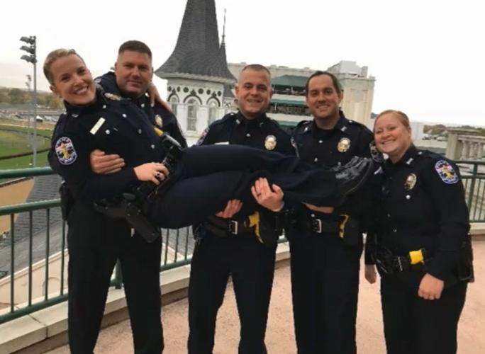 Det. Deidre Mengedoht (with officers).jpg