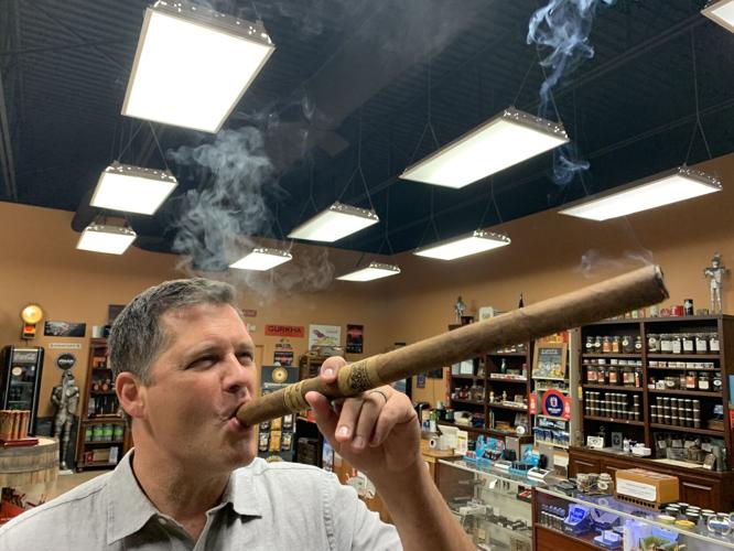 Keith smokes huge cigar
