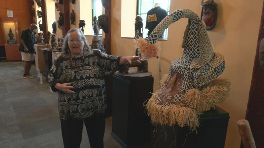 Julia Lewis discusses a piece of African art at Roots 101 African American Museum