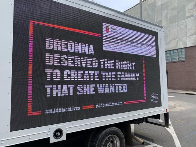 Breonna Taylor billboard parked outside LMPD HQ