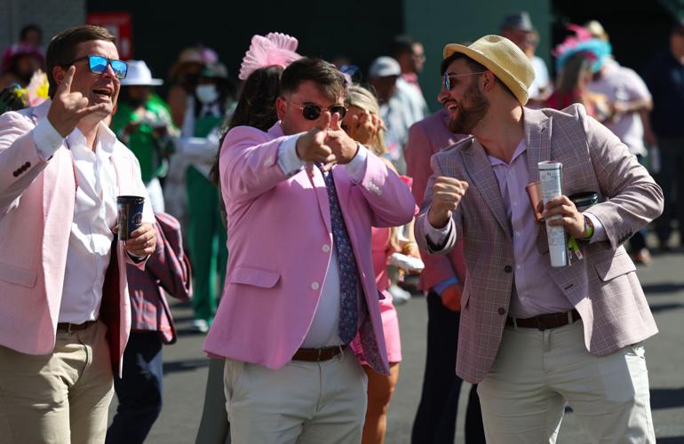 Men point at camera at Oaks.JPG