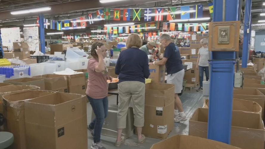 Volunteers for Louisville-based SOS pack medical supplies for JCPS students