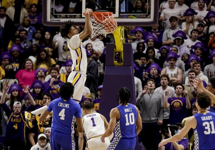 LSU forward Alex Fudge dunks over Kentucky forward Daimion Collins