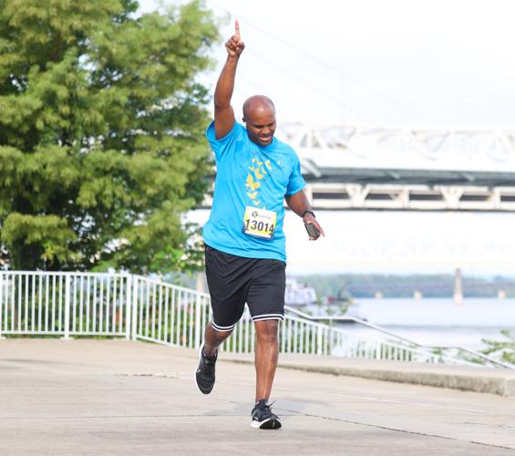 Man raises arm at Race to Cure Sarcoma.JPG