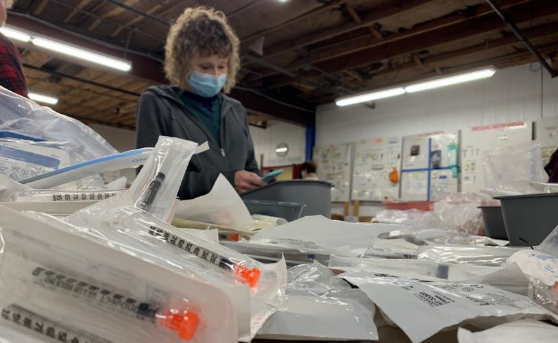 Volunteers at Louisville-based SOS assemble medical kits bound for Ukraine