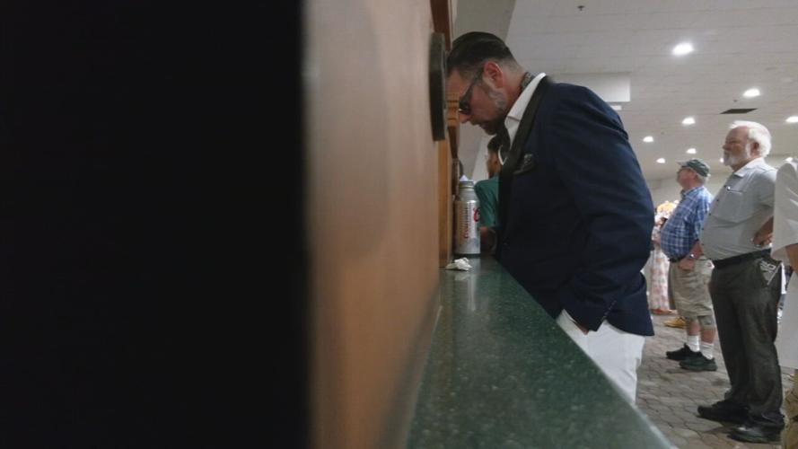 PLACING A BET AT CHURCHILL DOWNS.jpeg