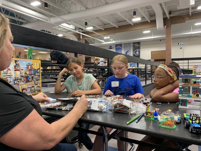 Children build Lego in Charlestown.jpeg