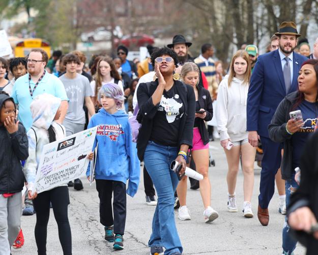 Woman cheers to crowd during March on Frankfort.JPG