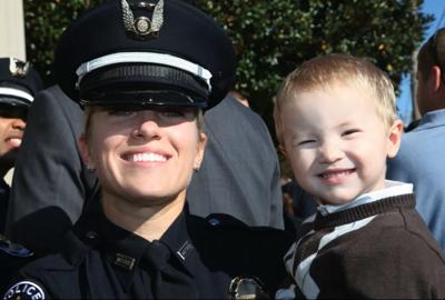 Det. Deidre Mengedoht (with a child).jpg