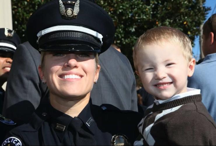 Det. Deidre Mengedoht (with a child).jpg