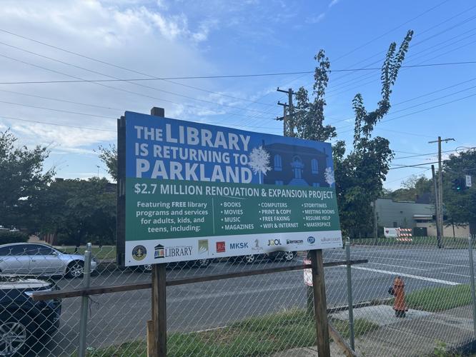 Sign outside of the Portland Library letting the community known about its return