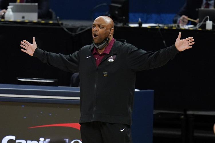 Florida State head coach Leonard Hamilton questions a call against Michigan.jpeg