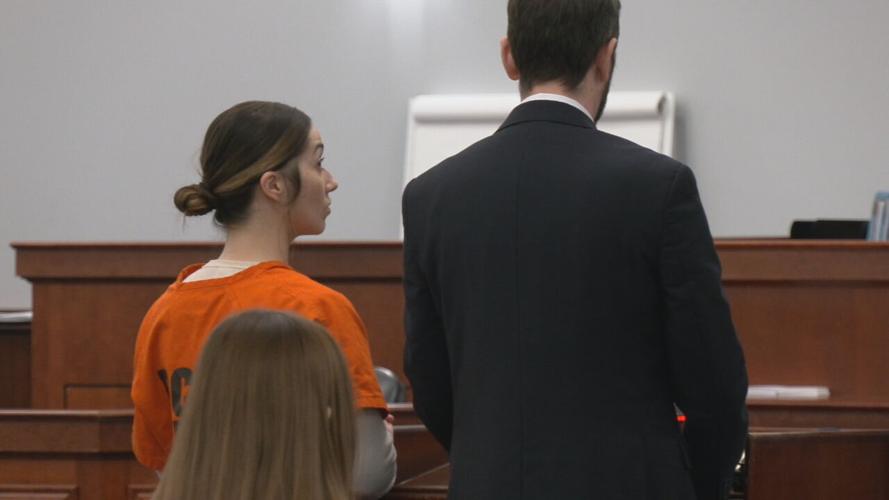 Tiffanie Lucas at the podium to face Judge Rodney Burress inside a Bullitt County courtroom on Jan. 8, 2024 for a status hearing. (WDRB photo)