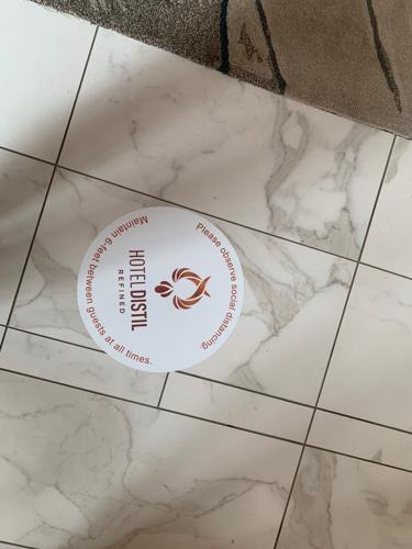 Hotel Distil social distancing sign