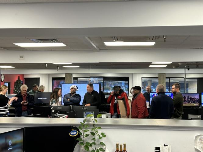 Dave White Retirement Crowd in newsroom.JPG