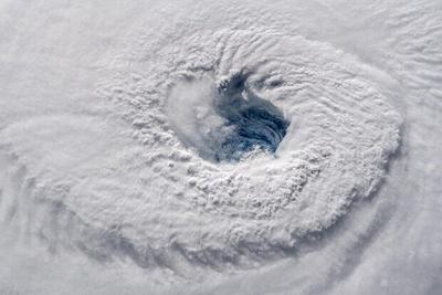 What are the finger-like clouds in the hurricane inner-core region?