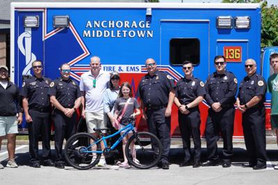 Girl receives new bicycle.jpg