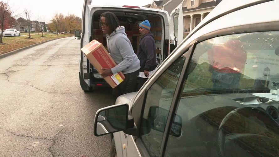 Louisville's Community Connections Group delivers frozen turkeys and chicken to community members ahead of the Thanksgiving holiday