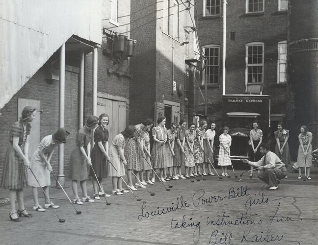 Unidentified Hillerich & Bradsby Co. employee gives golf lessons