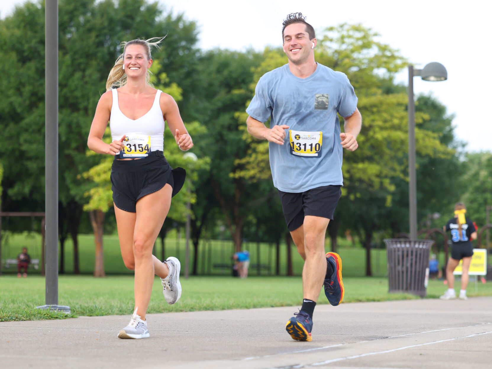 Two people run at Race to Cure Sarcoma.JPG