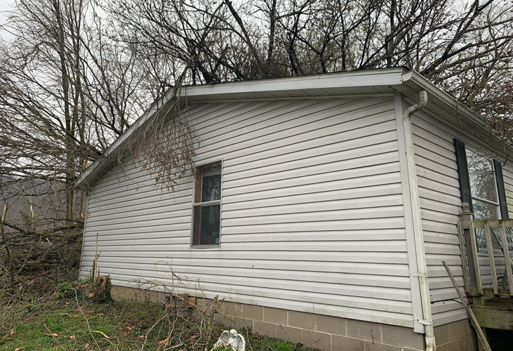 Home damaged by tornado in Milton, Kentucky