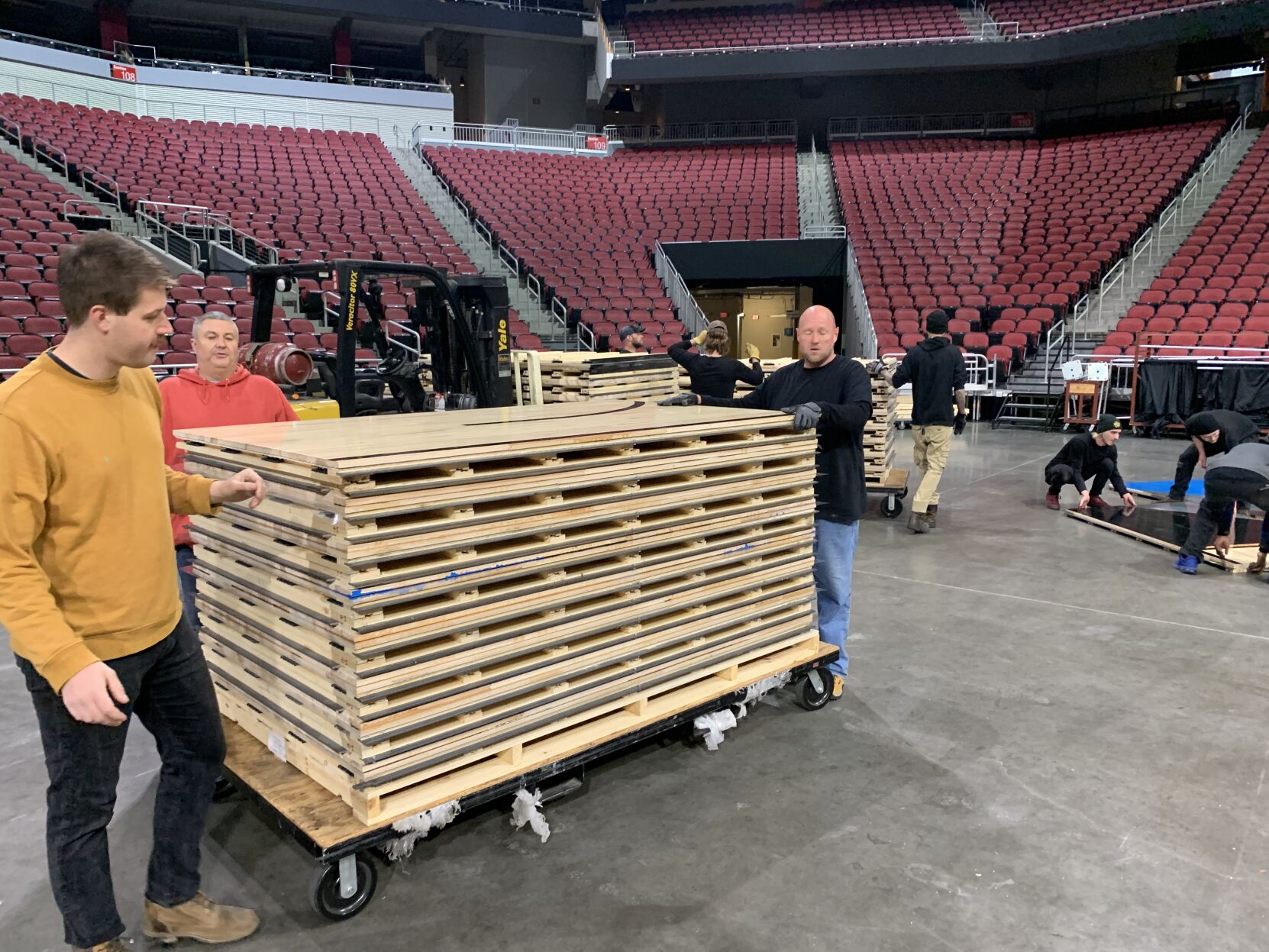 NCAA FLOOR  BEING INSTALLED AT YUM CENTER 3-21-2023 (16).JPG