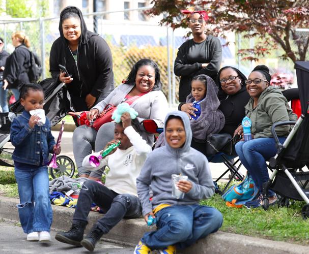 Family poses for photo at parade.JPG