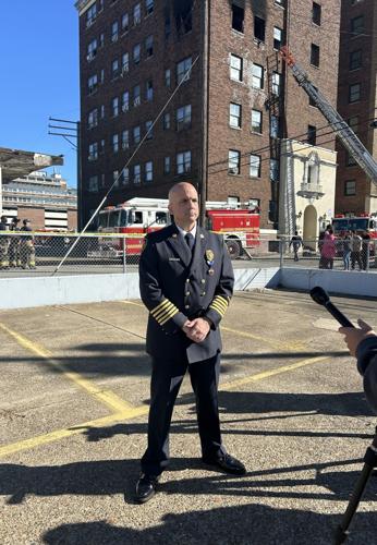 Louisville Fire Chief Brian O'Neill speak with media after an apartment fire near Old Louisville Tuesday morning