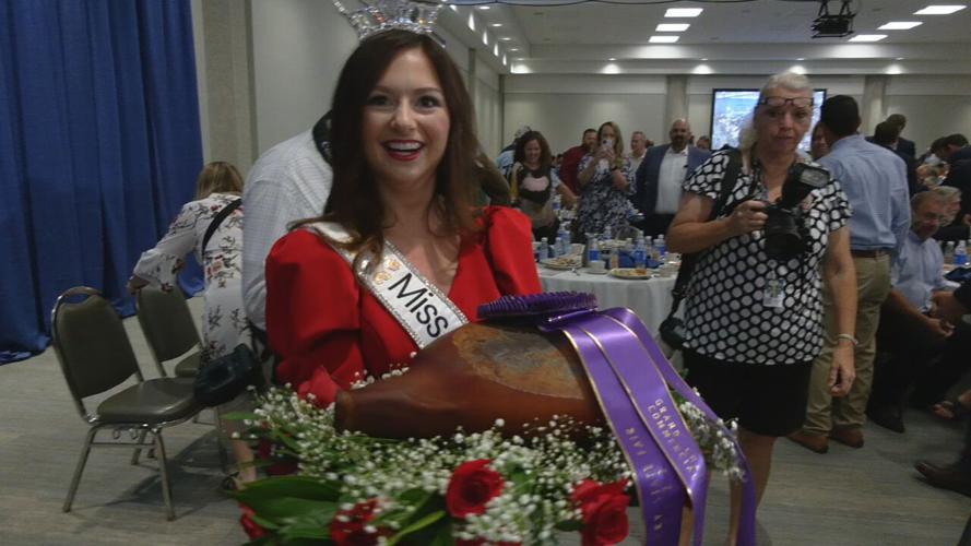 Miss Kentucky with Grand Champion Ham at Kentucky State Fair