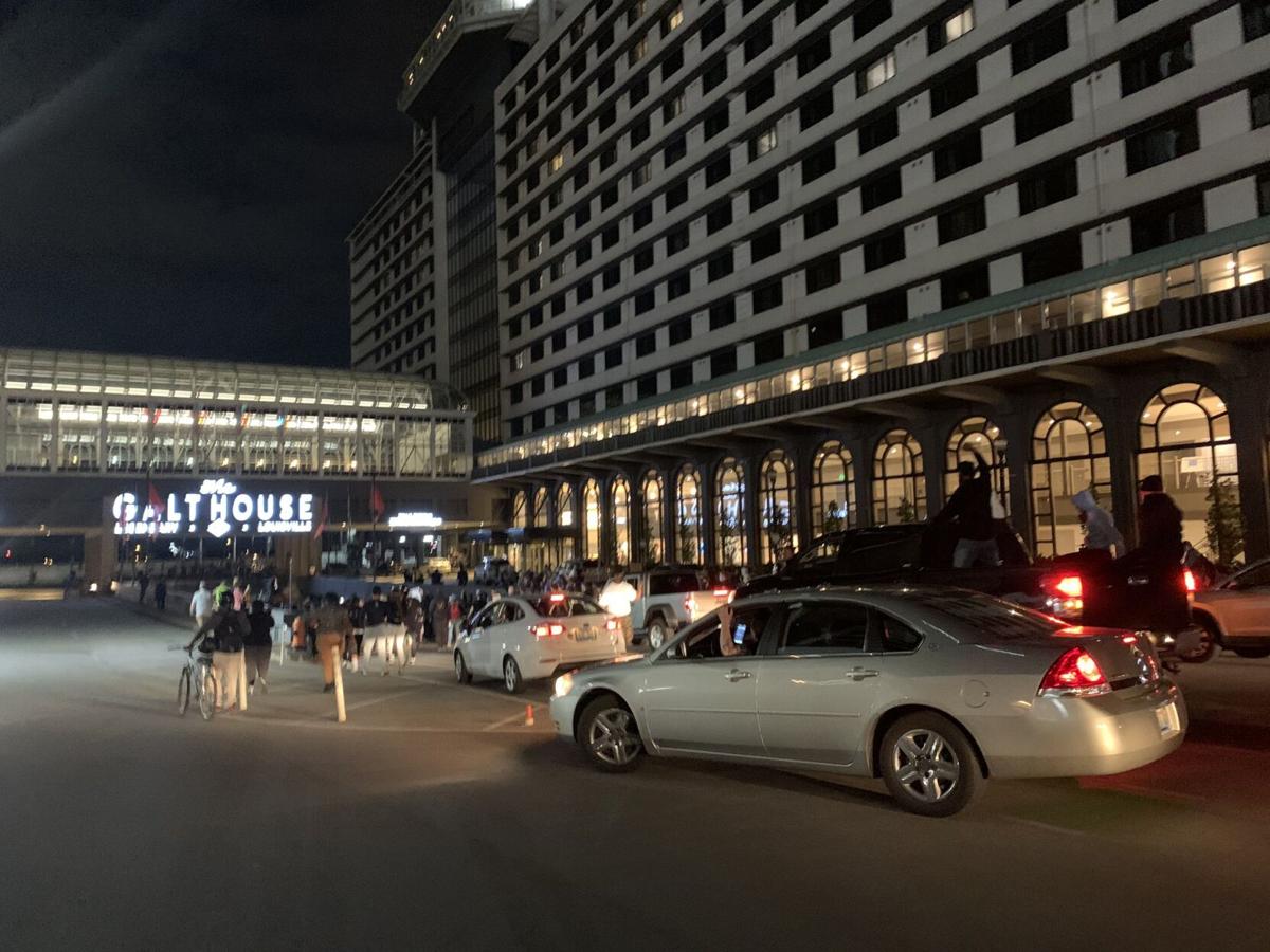 Protesters march past Galt House in downtown Louisville 9/24/20