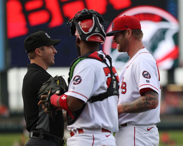 Umpire checks Ben Lively hands.JPG