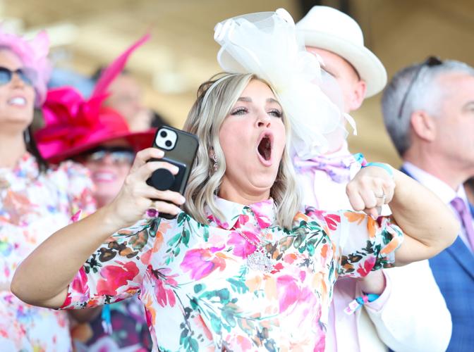 Woman shows excitement during race.JPG