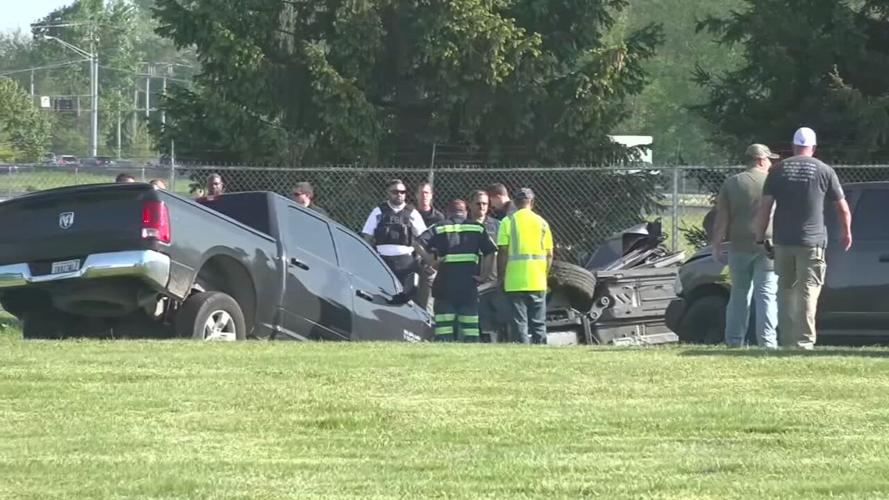 Investigators surround Cadillac sedan driven by fugitives Casey White and Vicky White (no relation) in May 2022